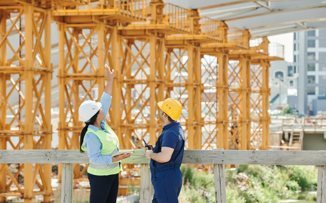 worker showing around a construction site